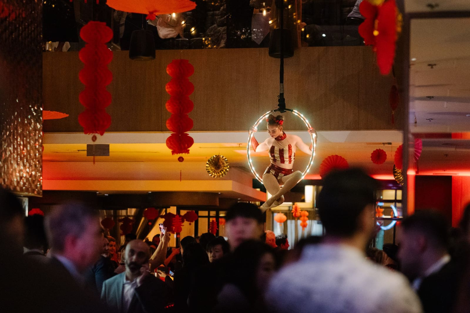An aerial performer on a hoop at a Lunar New Year event at Glowbal