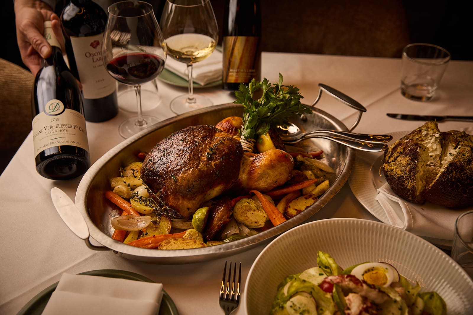 A whole roast served with wine at Riley’s Toronto