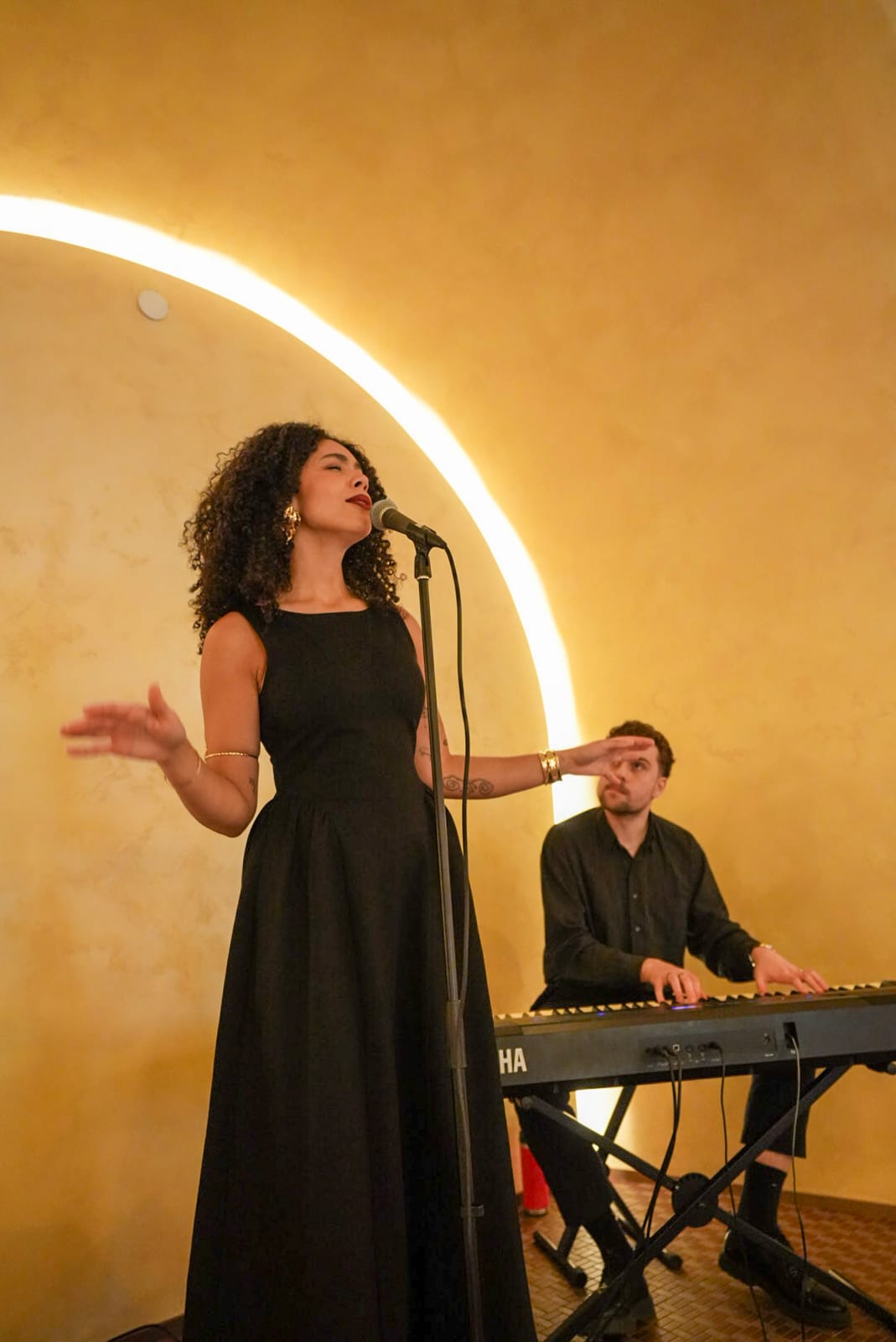 A singer performing at an event at Riley’s Toronto