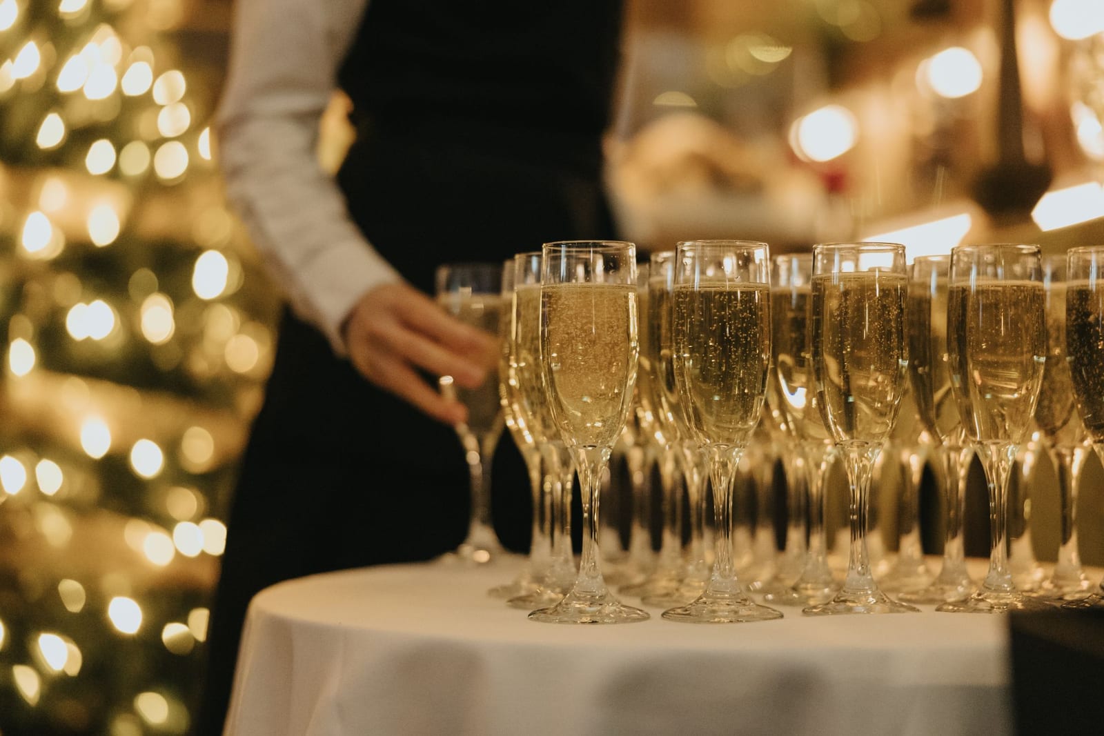 Champagne poured beside the Christmas tree at Riley’s