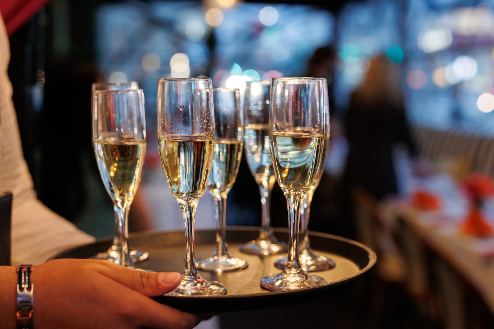 Champagne passed on a tray at a Trattoria event